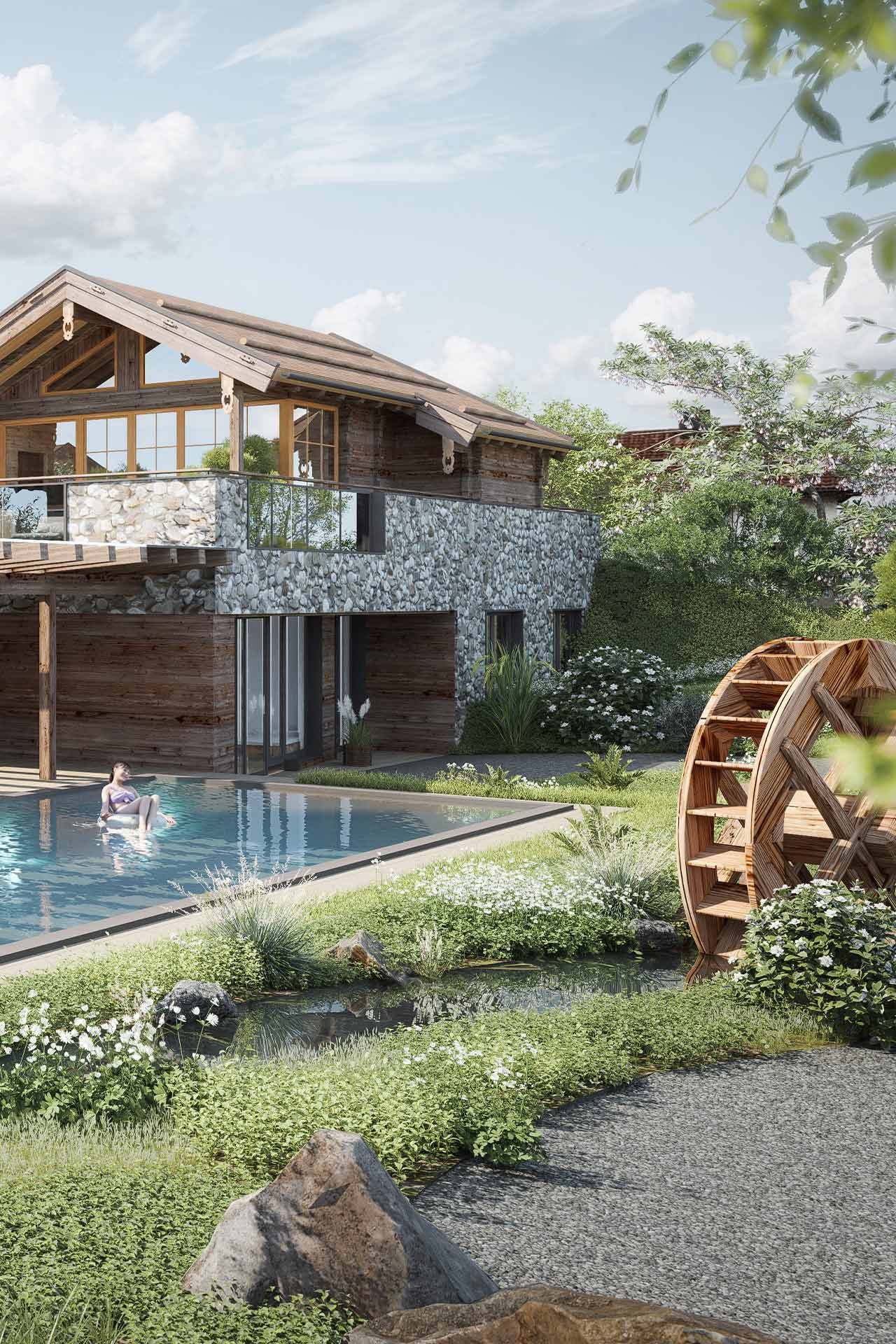 A modern stone and wood house is situated next to a tranquil swimming pool, surrounded by lush greenery and flowering plants. A wooden waterwheel is visible in the foreground, contributing to the serene, nature-inspired atmosphere.